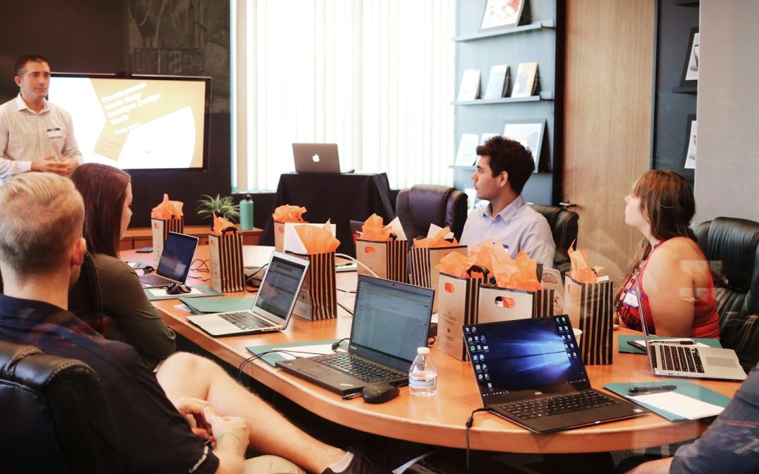 Business team reviewing financial information and commercial decisions during a meeting.
