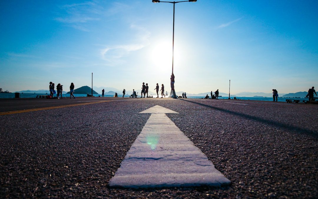 People following a clear pathway toward the horizon, representing business vision and direction.